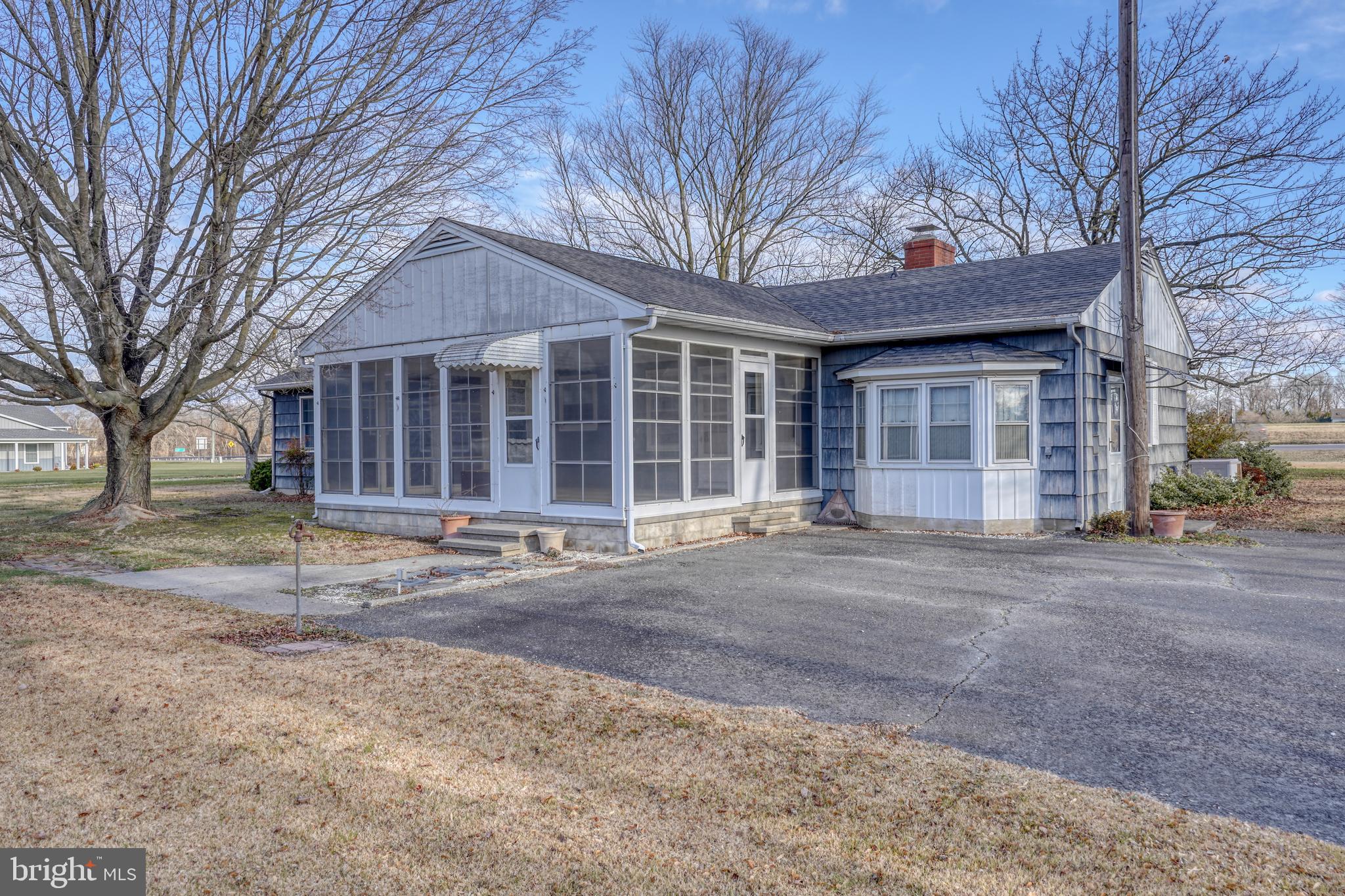 4215 Preston Road Hurlock, MD 21643 - Photo 3 of 40 a house with a trees in front of it