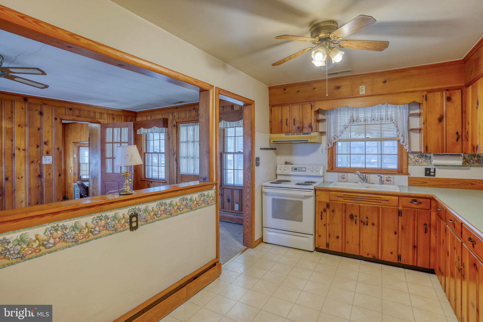 4215 Preston Road Hurlock, MD 21643 - Photo 10 of 40 a large kitchen with stainless steel appliances granite countertop a refrigerator and a sink