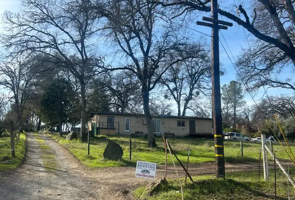 a view of backyard with trampoline