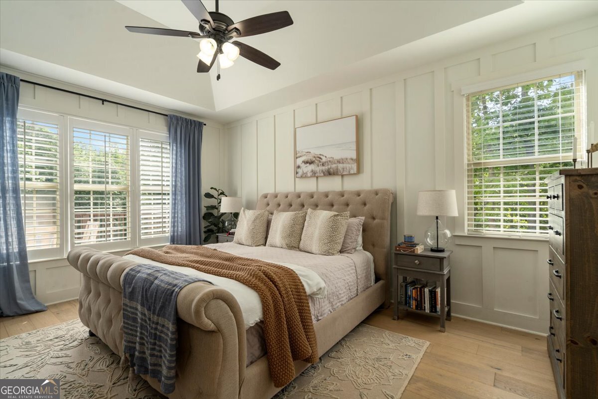 3093 Surry Ridge Drive Watkinsville, GA 30677 - Photo 12 of 41 a bedroom with a bed and a chandelier