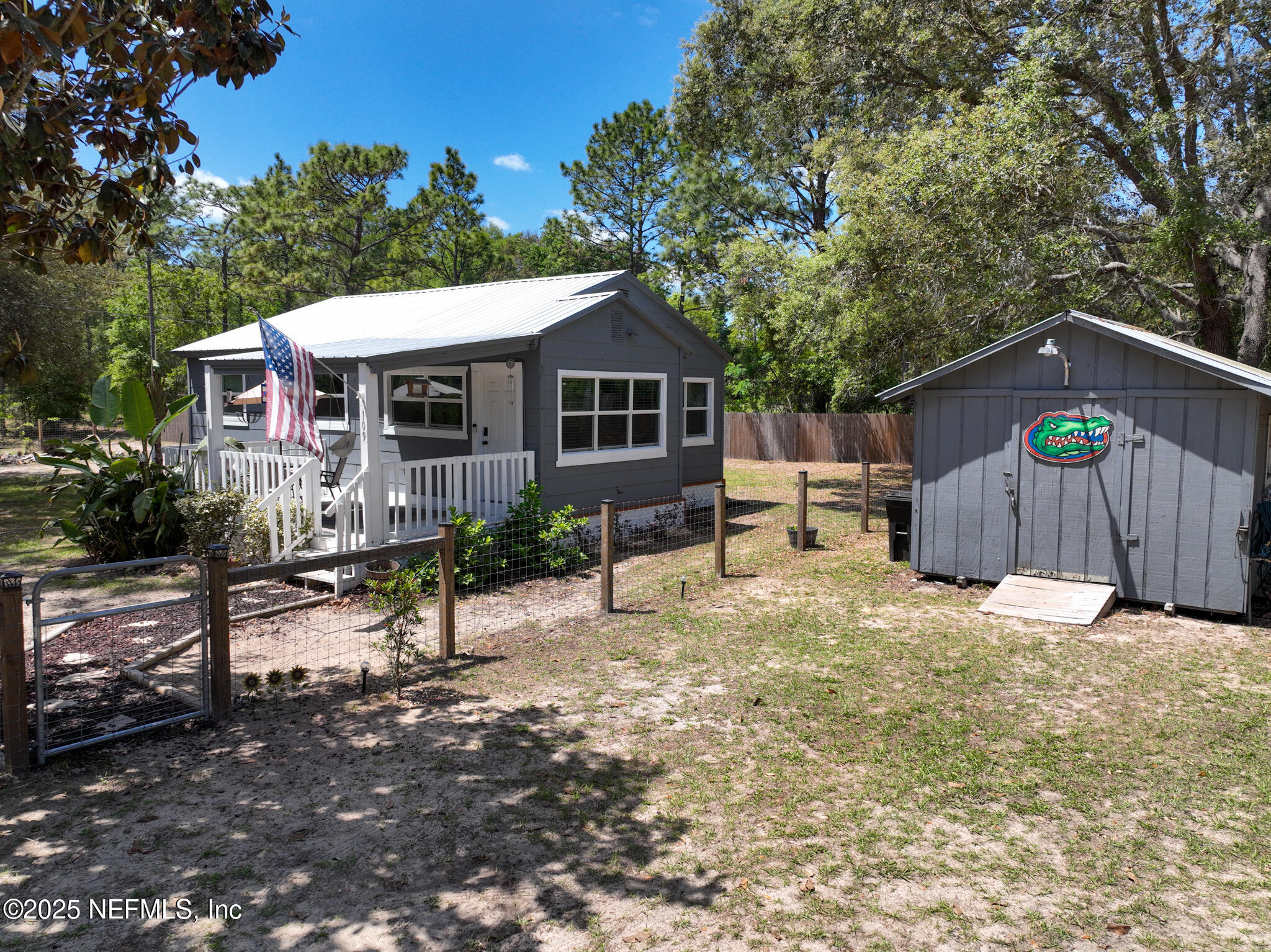 109 Mason Road Melrose, FL 32666 - Photo 18 of 27 a backyard of a house with seating space