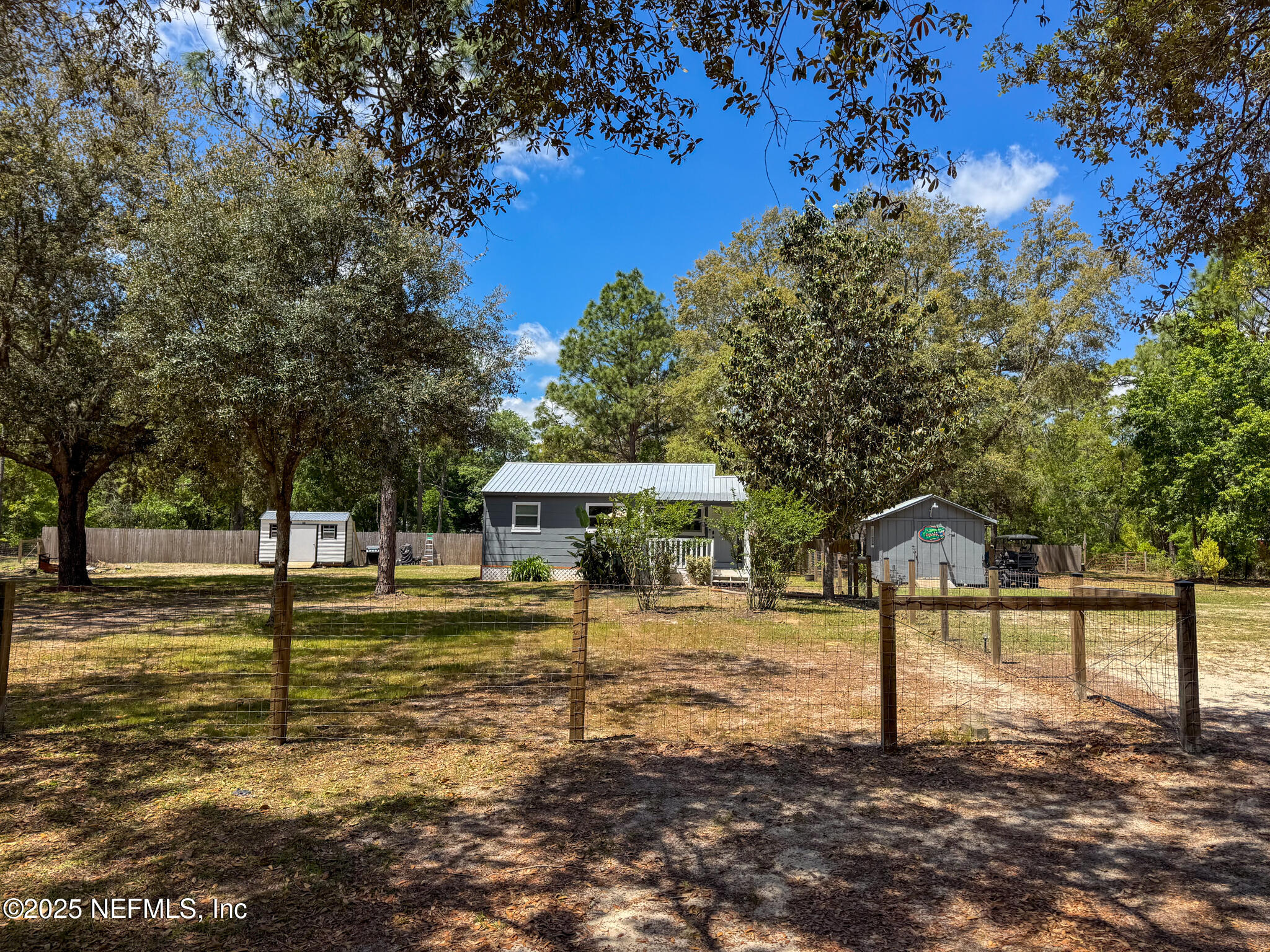 109 Mason Road Melrose, FL 32666 - Photo 2 of 27 a view of a yard with a tree