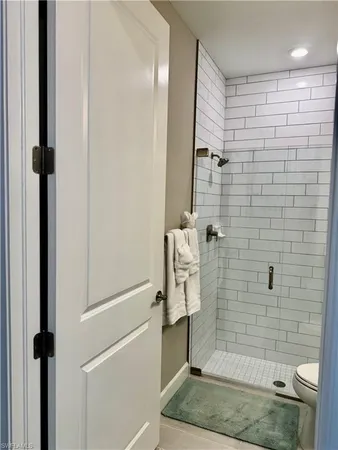 a bathroom with a shower and a toilet