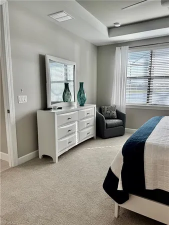 a living room with furniture and windows