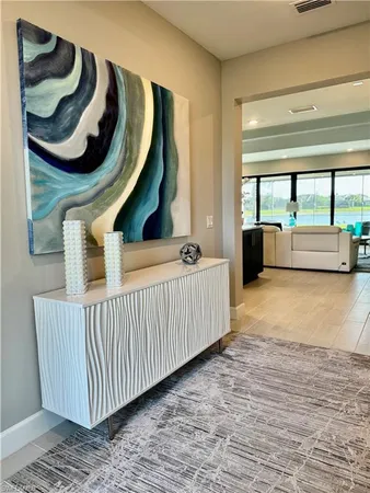 a living room with a couch and a large window