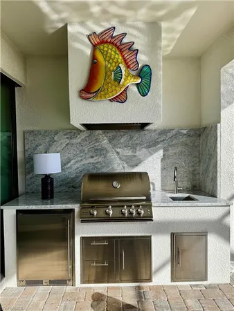 a stove top oven sitting inside of a kitchen