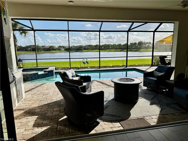 a view of a living room and balcony
