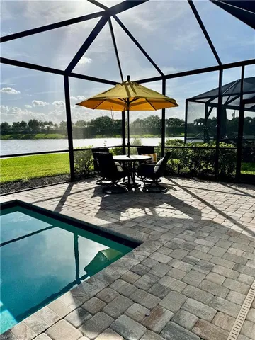 a view of a swimming pool with a porch