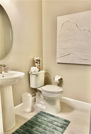 a bathroom with a toilet and a sink