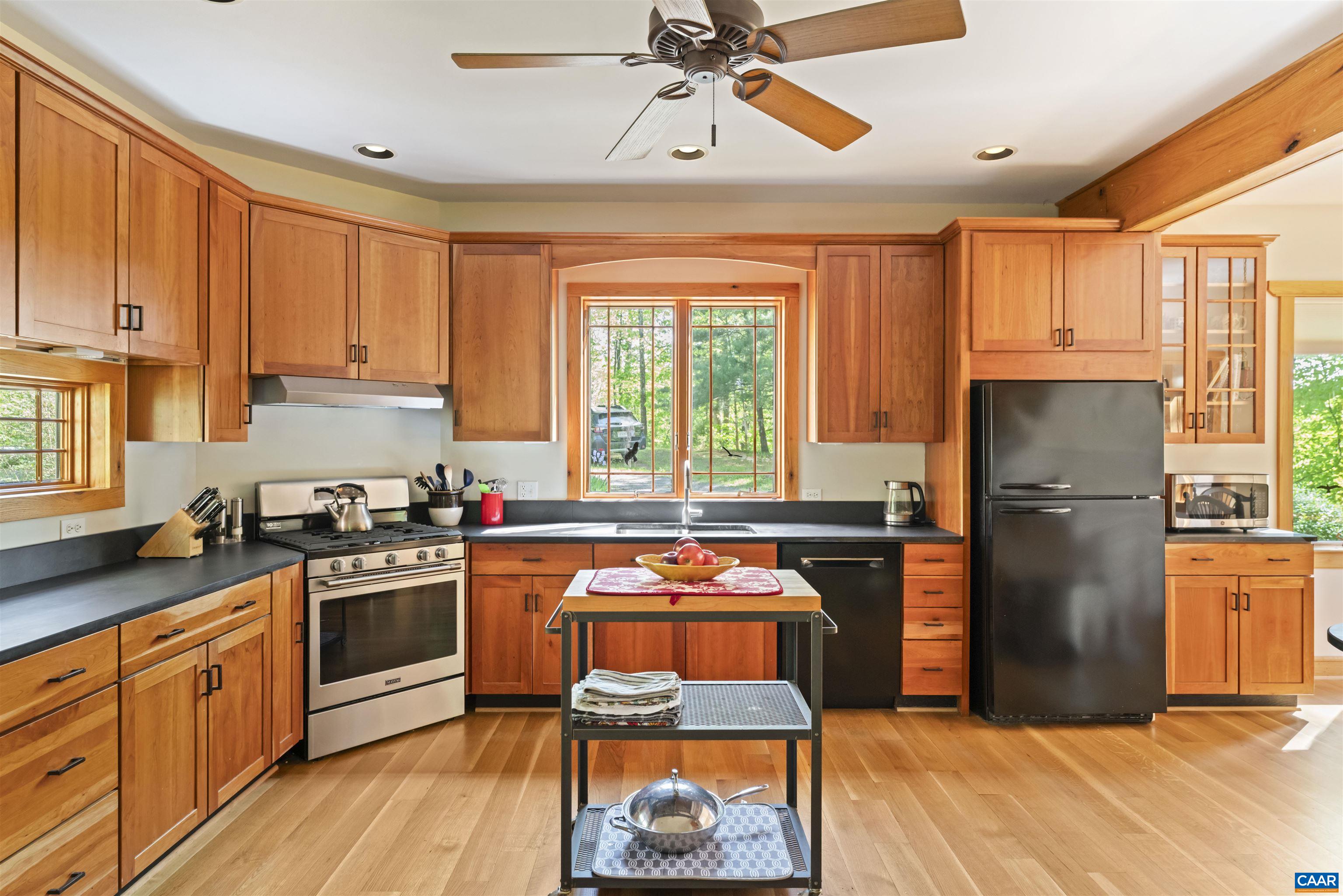 7530 Damon Road Schuyler, VA 22969 - Photo 15 of 72 a kitchen with stainless steel appliances granite countertop a refrigerator a stove a sink dishwasher and wooden cabinets
