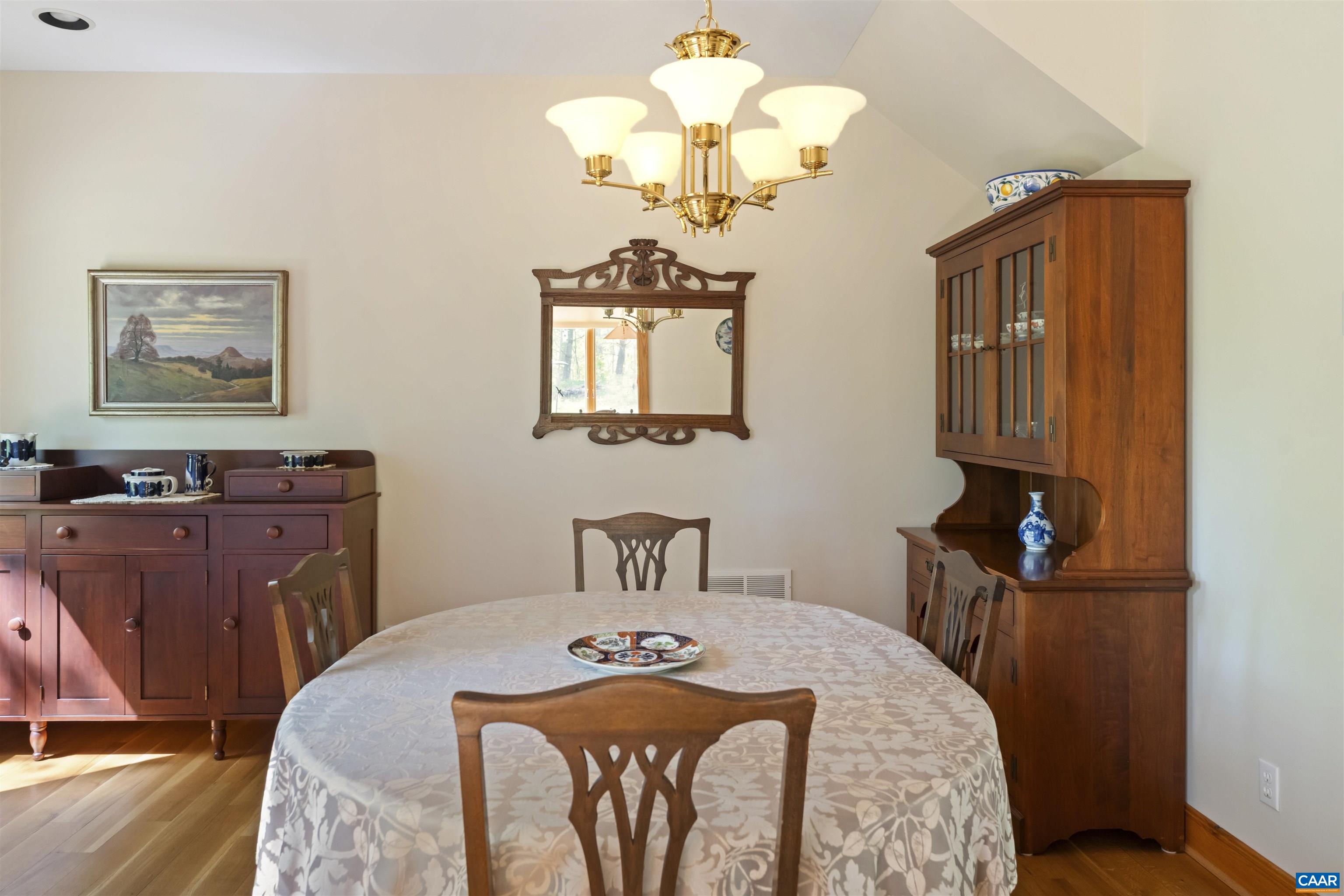 7530 Damon Road Schuyler, VA 22969 - Photo 21 of 72 a bedroom with a bed and a chandelier