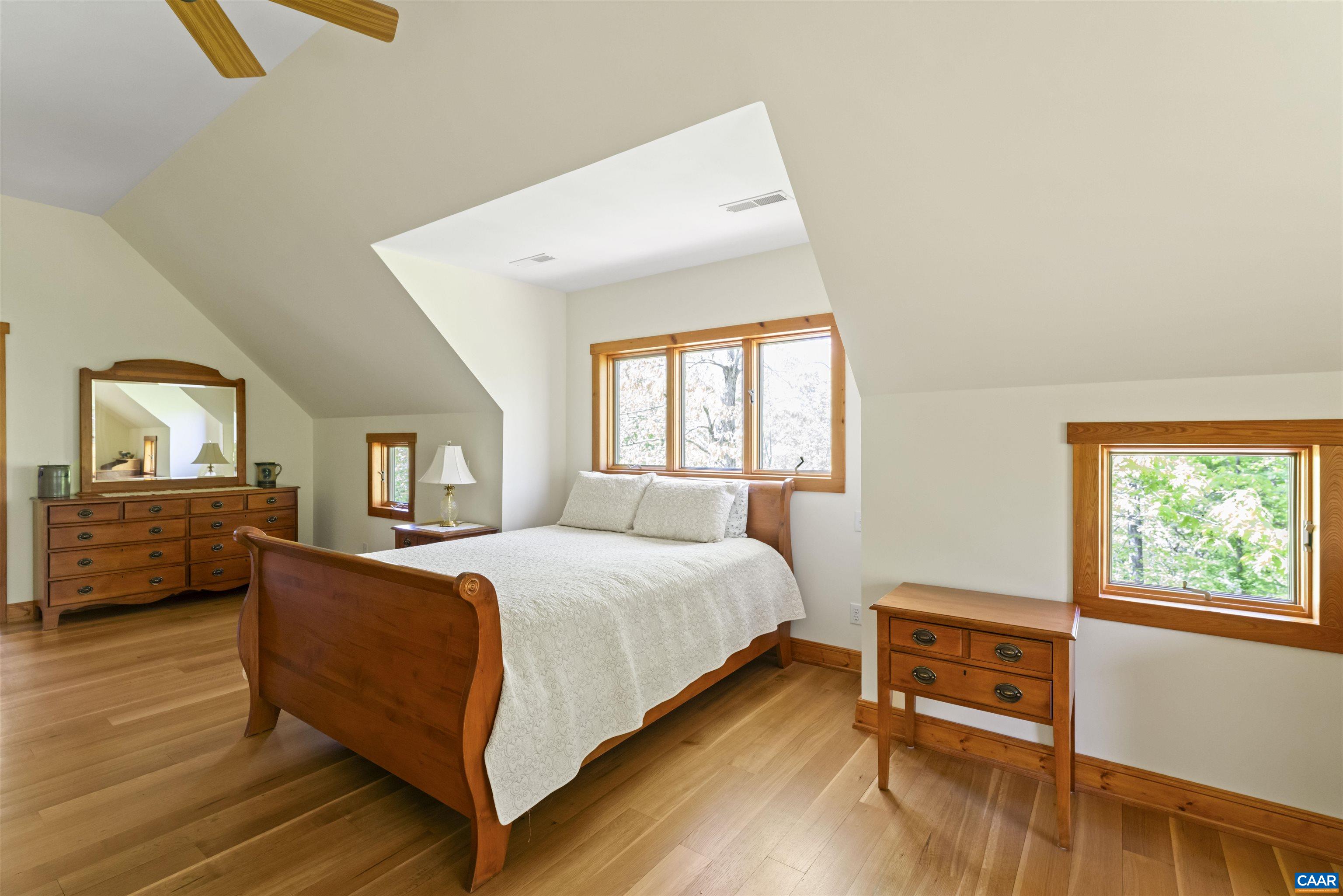 7530 Damon Road Schuyler, VA 22969 - Photo 29 of 72 a bedroom with a bed and wooden floor