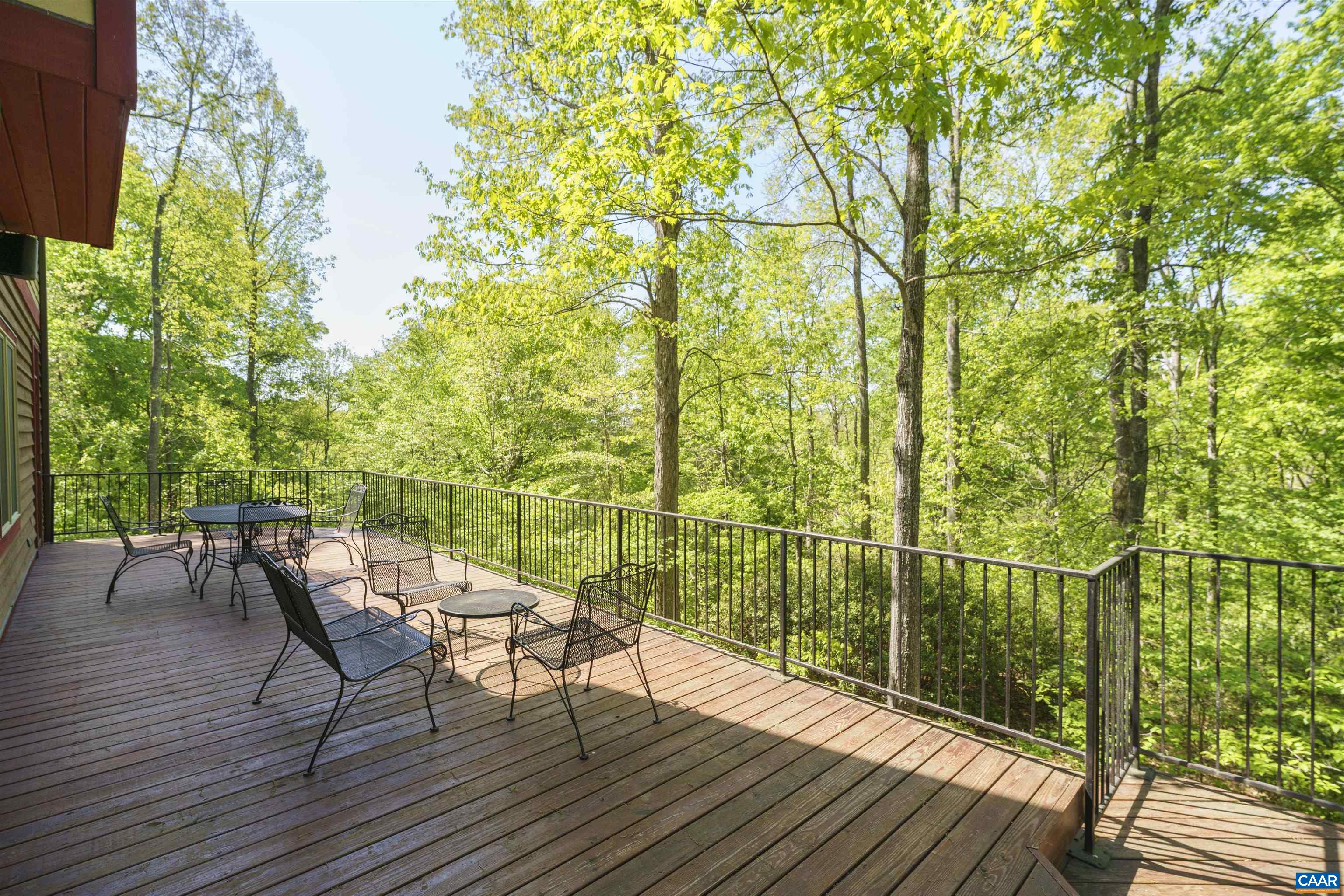 7530 Damon Road Schuyler, VA 22969 - Photo 47 of 72 a view of a chairs and table on the wooden deck