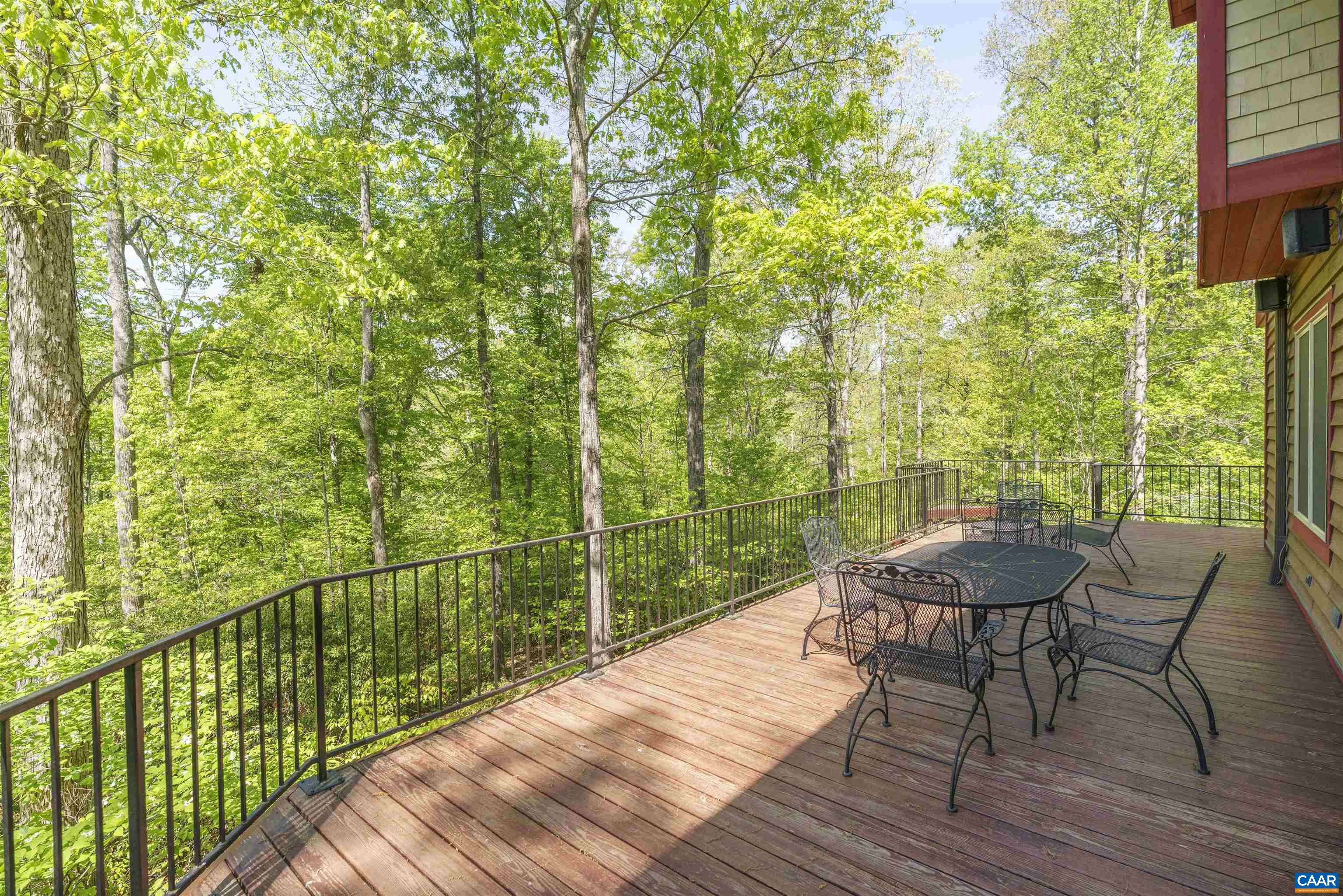 7530 Damon Road Schuyler, VA 22969 - Photo 48 of 72 a view of a balcony with furniture and wooden floor