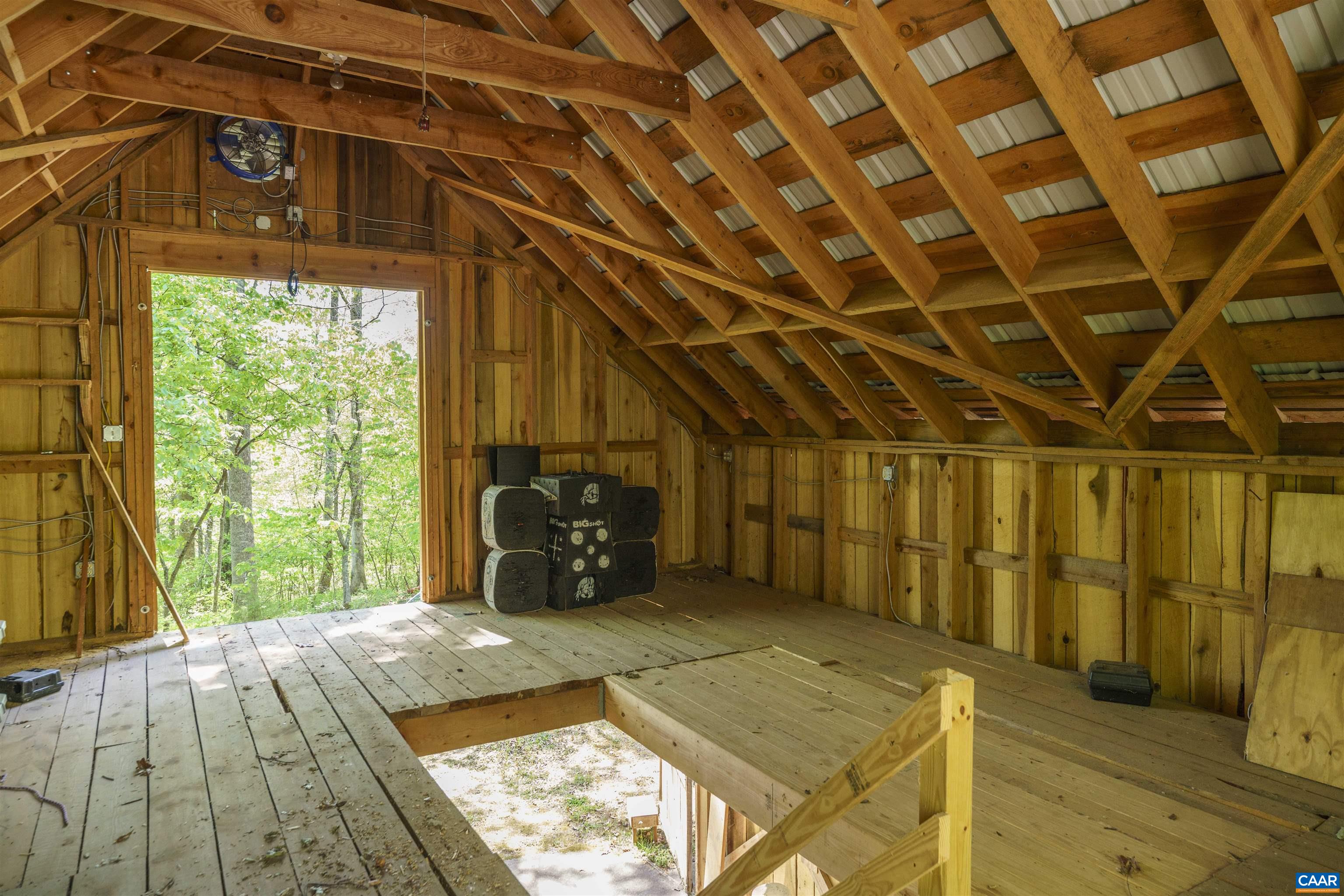 7530 Damon Road Schuyler, VA 22969 - Photo 55 of 72 a view of a room with wooden floor and iron stairs