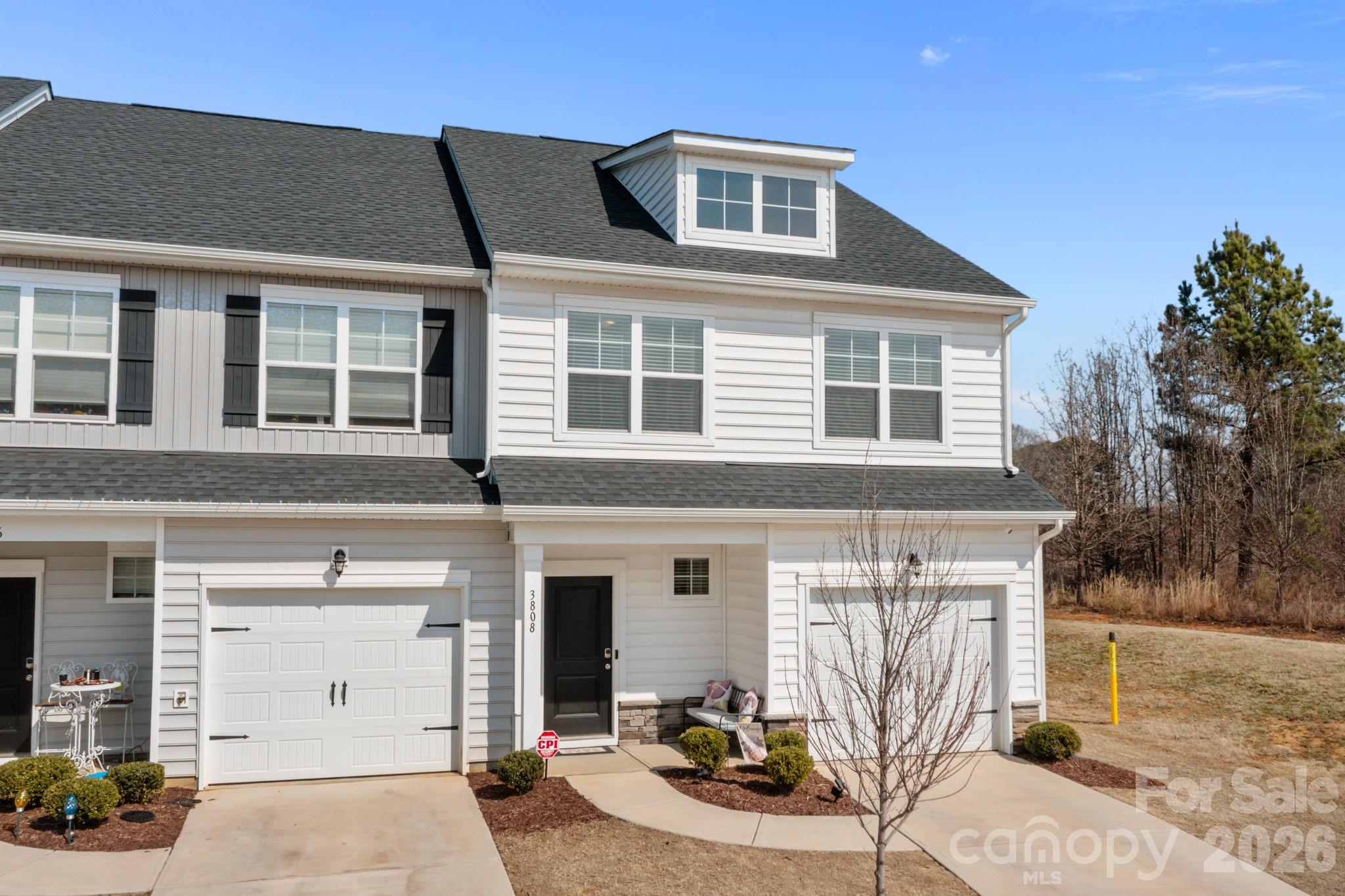 3808 Yorkshire Place Terrell, NC 28682 - Photo 1 of 36 a front view of a house with a garden