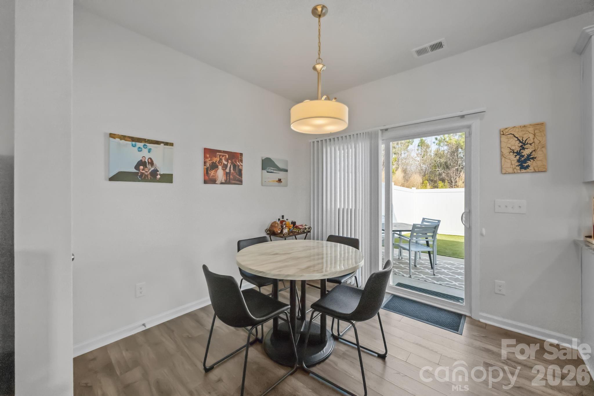 3808 Yorkshire Place Terrell, NC 28682 - Photo 18 of 36 a view of a dining room with furniture window and wooden floor