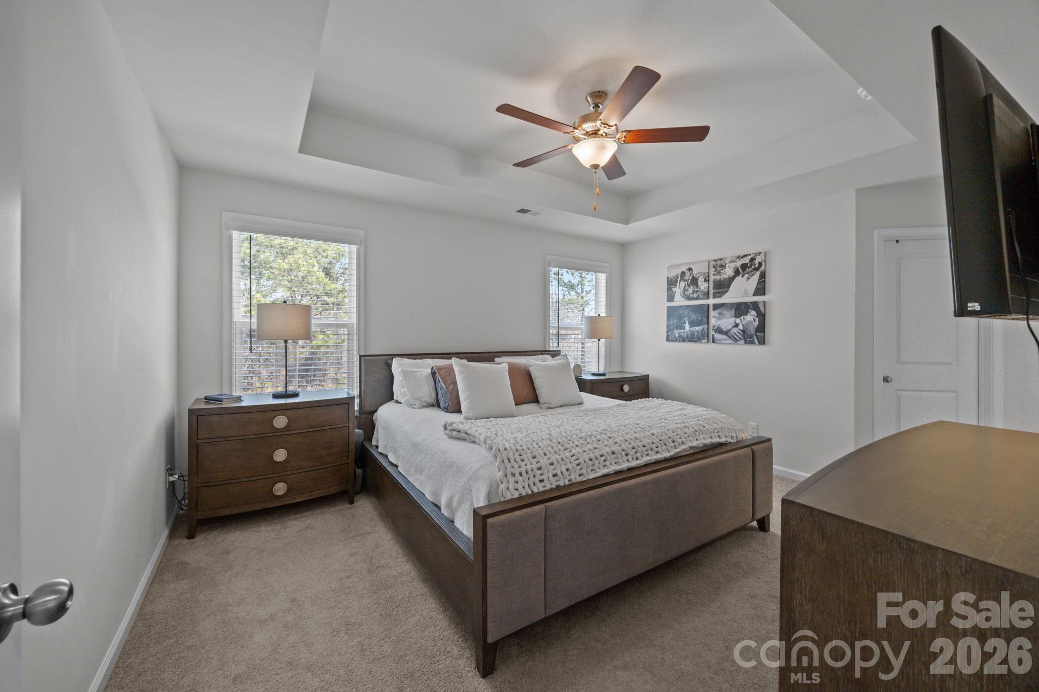 3808 Yorkshire Place Terrell, NC 28682 - Photo 21 of 36 a spacious bedroom with a bed and a chandelier