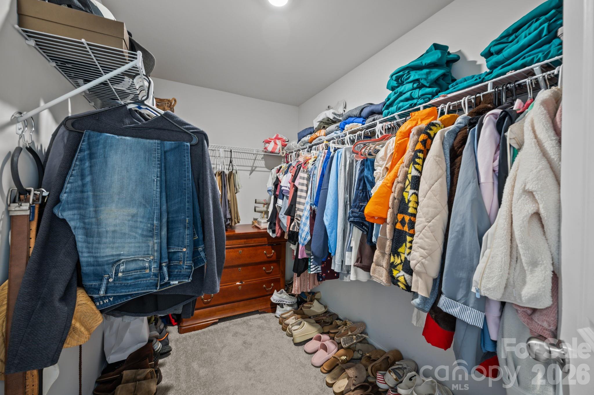 3808 Yorkshire Place Terrell, NC 28682 - Photo 22 of 36 a view of walk in closet with clothes and shoes