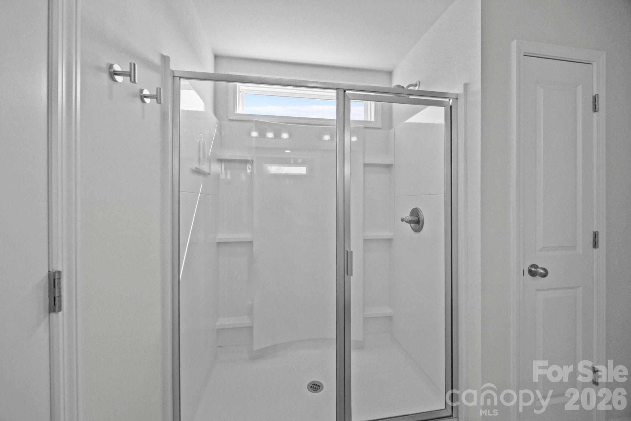 3808 Yorkshire Place Terrell, NC 28682 - Photo 24 of 36 a bathroom with a glass shower door