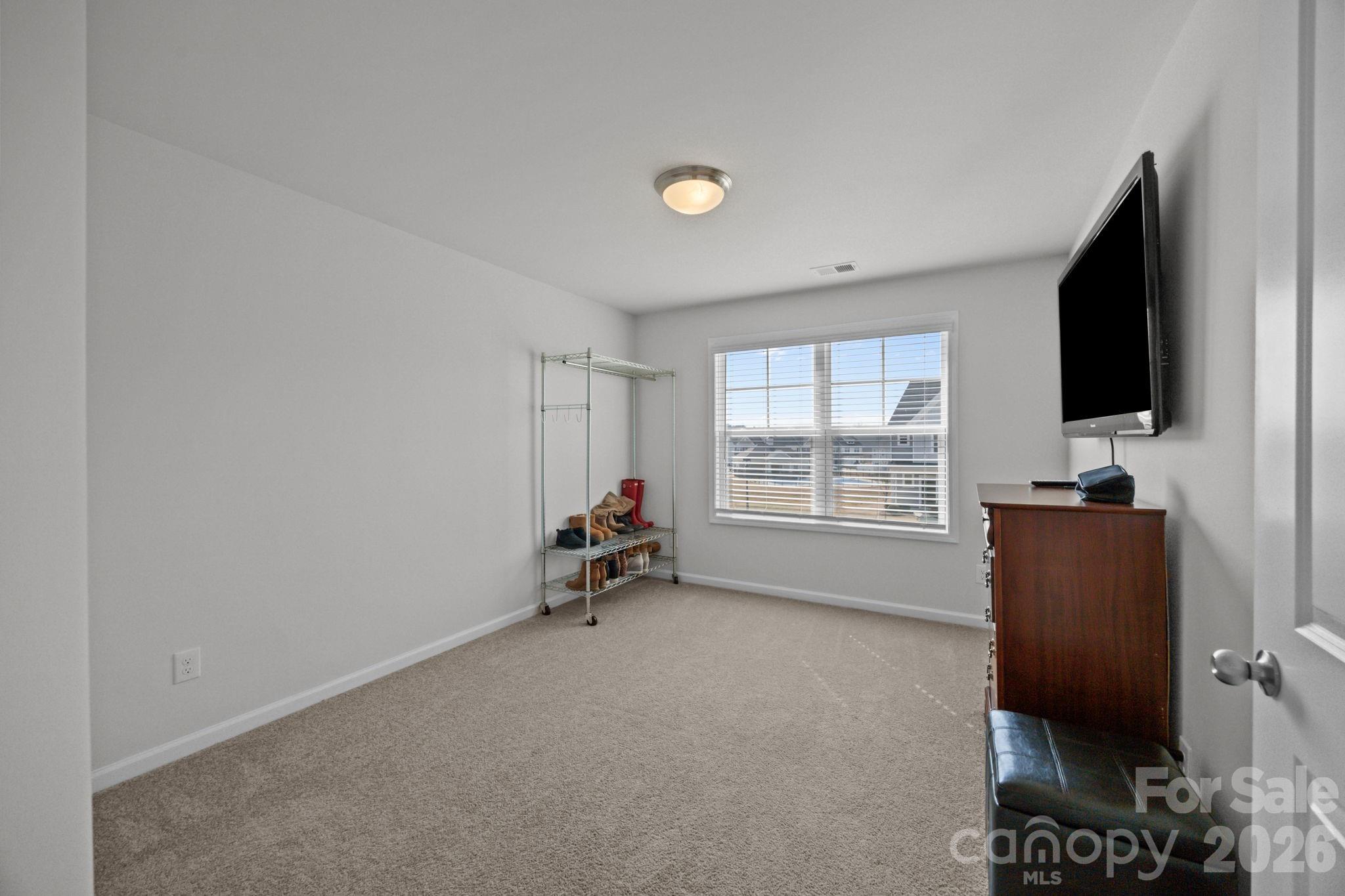 3808 Yorkshire Place Terrell, NC 28682 - Photo 26 of 36 a room with furniture and a flat screen tv