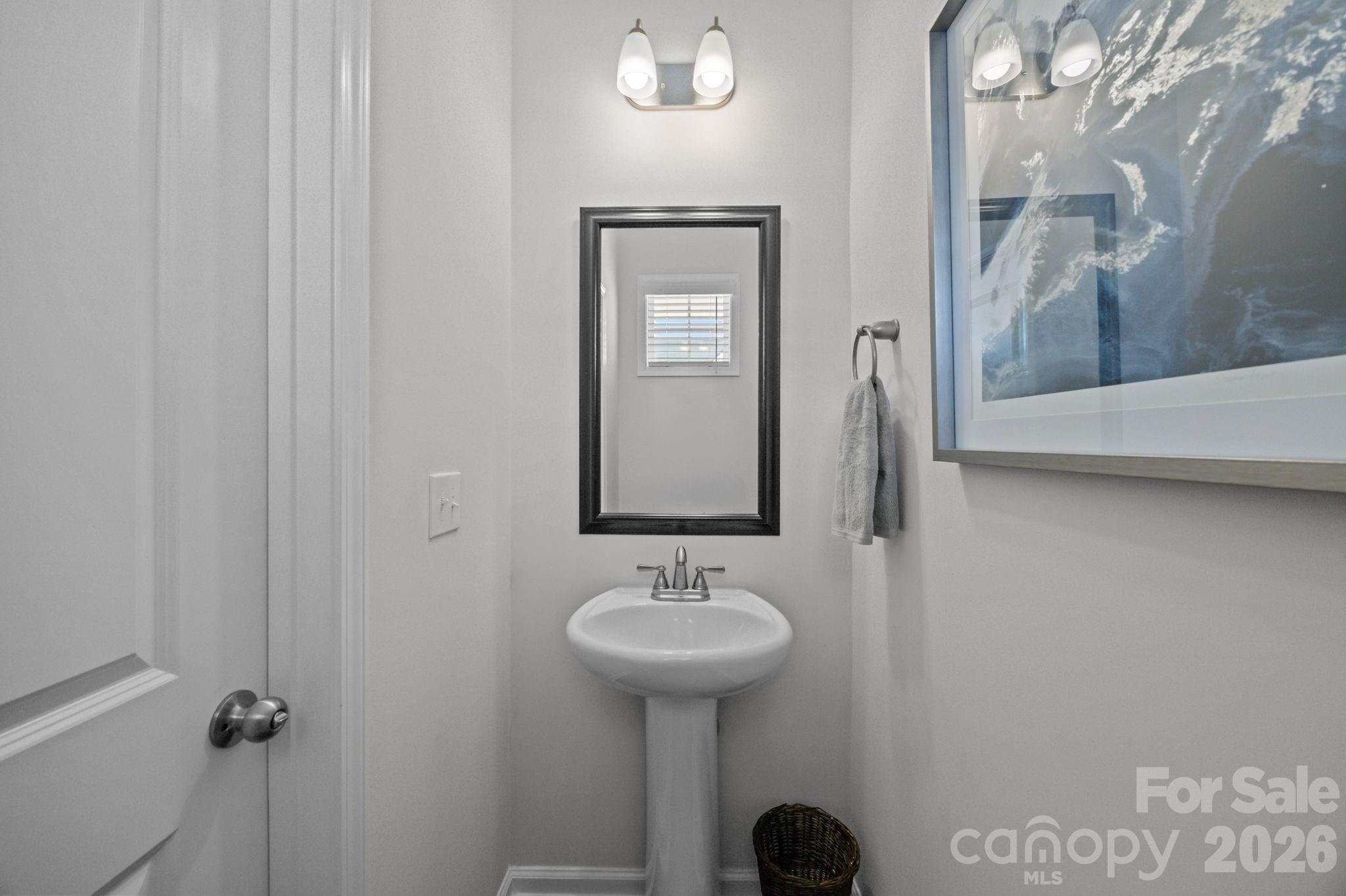 3808 Yorkshire Place Terrell, NC 28682 - Photo 7 of 36 a bathroom with a sink and a mirror