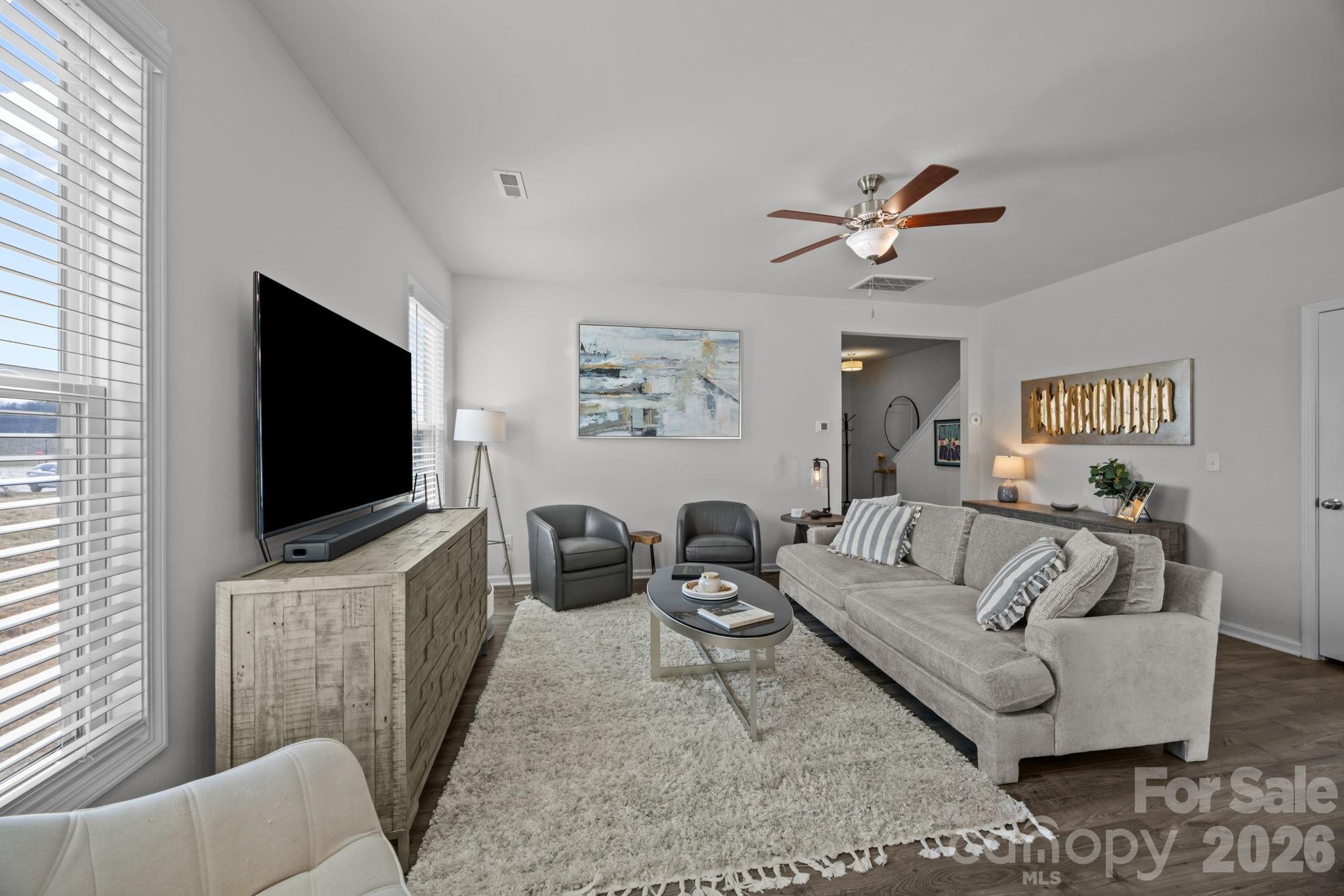 3808 Yorkshire Place Terrell, NC 28682 - Photo 10 of 36 a living room with furniture and a flat screen tv