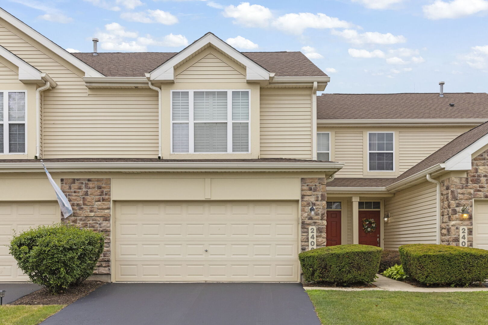 2406 Georgetown Circle Aurora, IL 60503 - Photo 1 of 28 a front view of a house with a yard