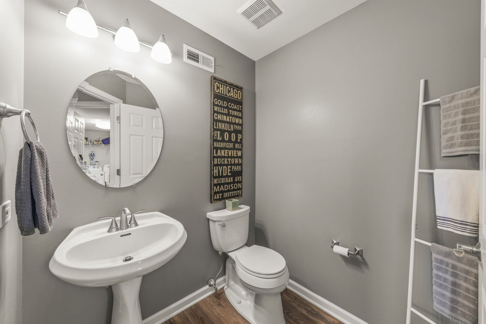 2406 Georgetown Circle Aurora, IL 60503 - Photo 15 of 28 a bathroom with a toilet a sink and a mirror