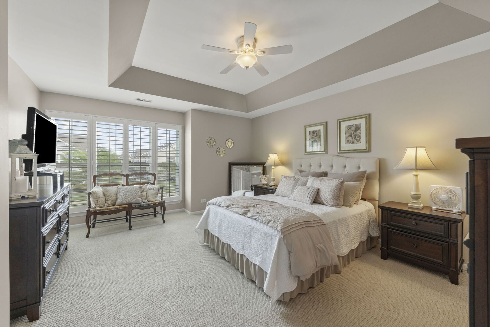 2406 Georgetown Circle Aurora, IL 60503 - Photo 18 of 28 a spacious bedroom with a bed and a flat tv screen
