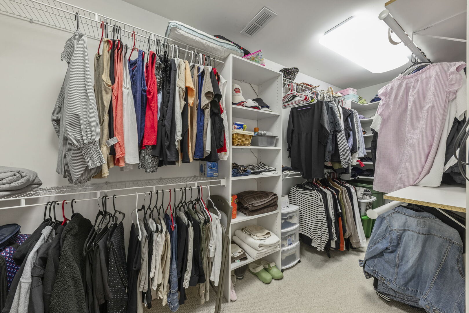 2406 Georgetown Circle Aurora, IL 60503 - Photo 22 of 28 a view of walk in closet with clothes