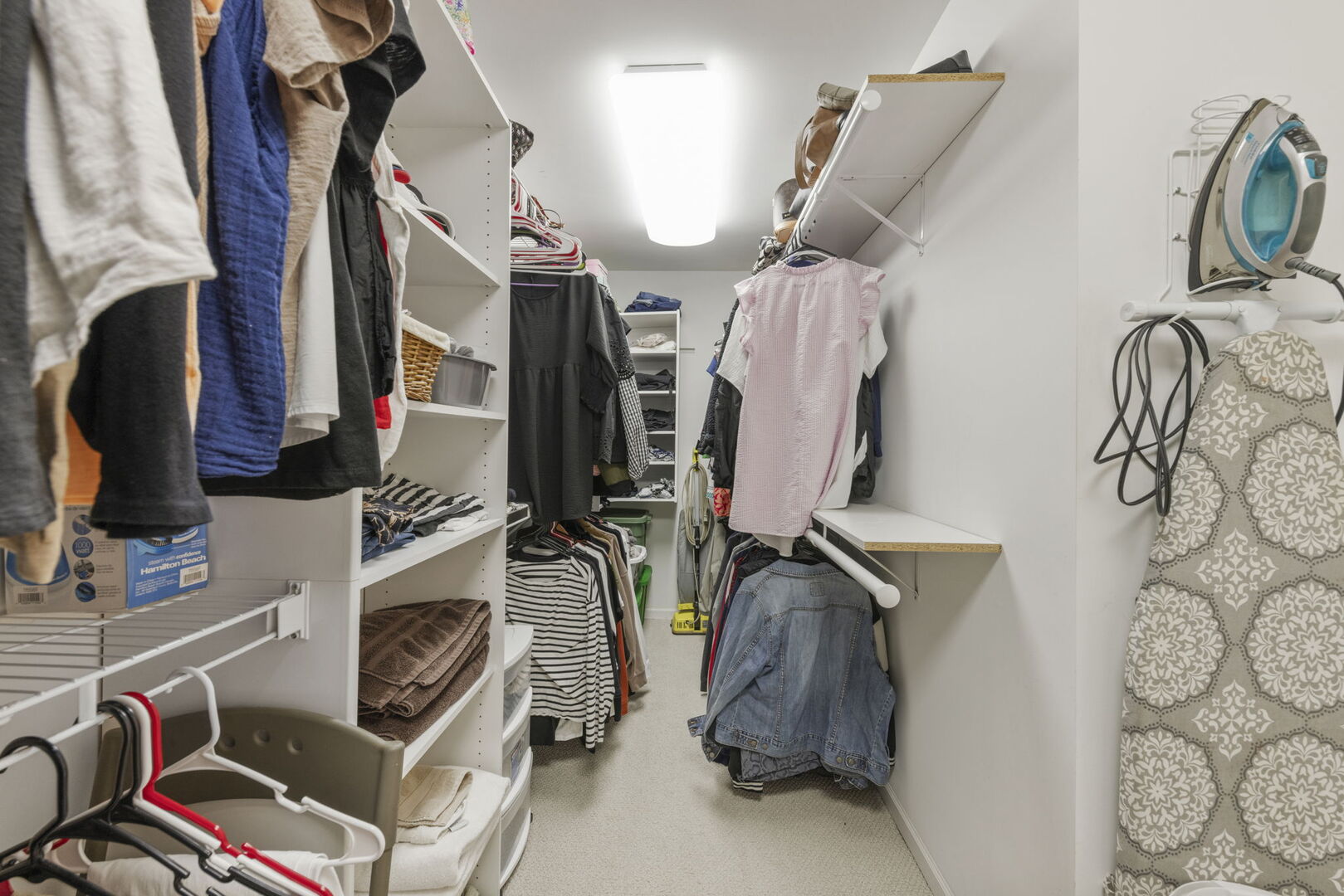 2406 Georgetown Circle Aurora, IL 60503 - Photo 23 of 28 a view of walk in closet with clothes and shoes