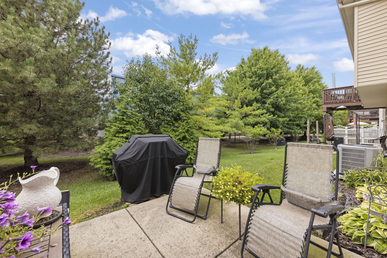 2406 Georgetown Circle Aurora, IL 60503 - Photo 26 of 28 a view of a chairs and table in the patio