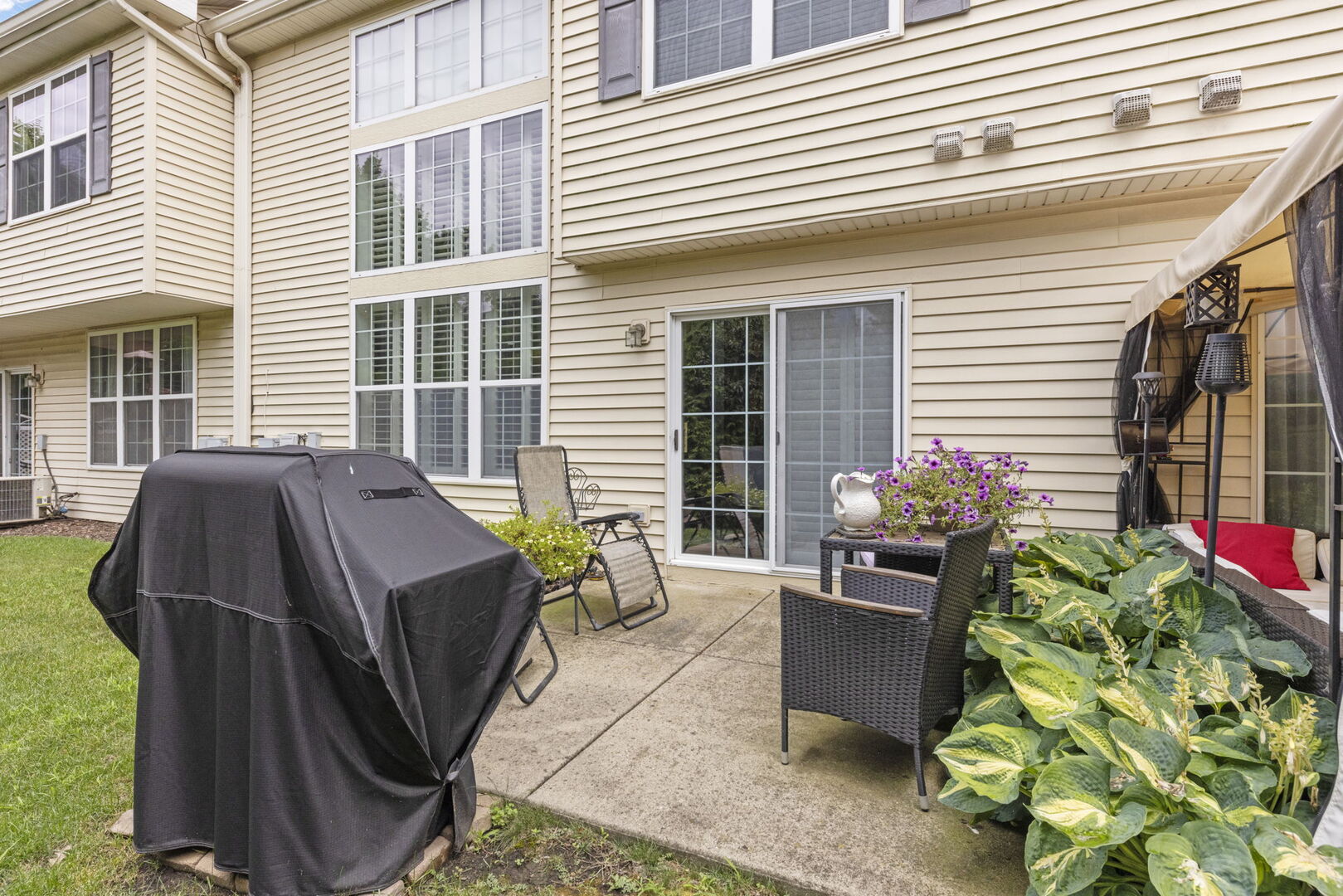 2406 Georgetown Circle Aurora, IL 60503 - Photo 27 of 28 a view of a house with outdoor seating