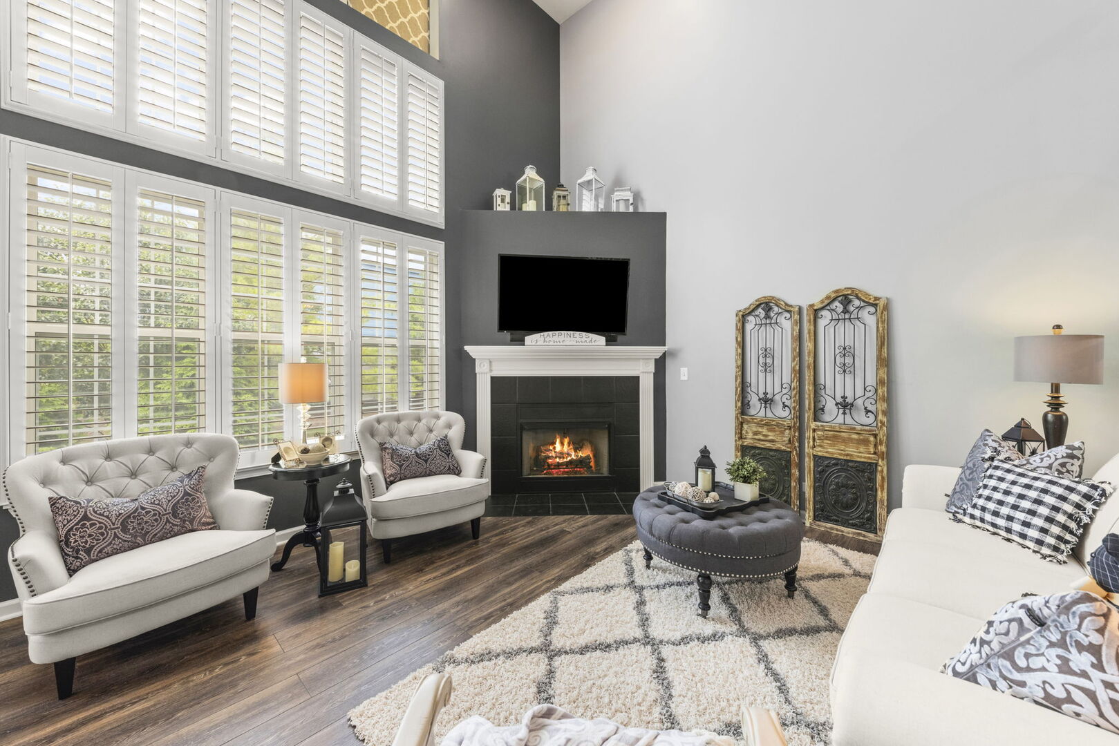 2406 Georgetown Circle Aurora, IL 60503 - Photo 5 of 28 a living room with furniture a fireplace and a large window
