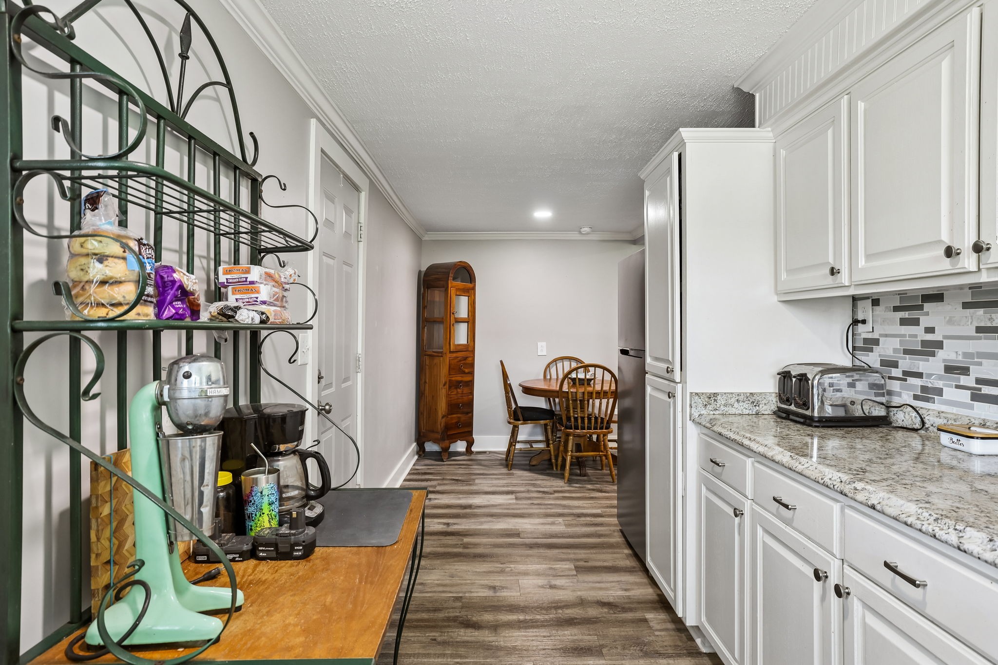 1466 Bible Crossing Road Winchester, TN 37398 - Photo 23 of 42 a kitchen with sink refrigerator and cabinets