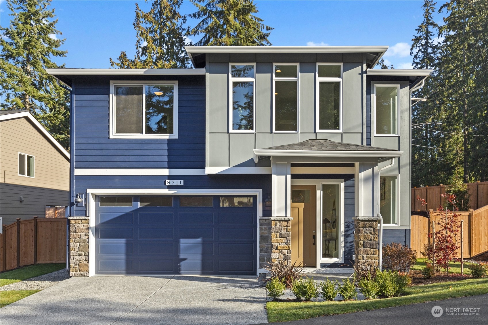 8711 240th Street Southwest Edmonds, WA 98026 - Photo 1 of 37 a view of a brick house with large windows