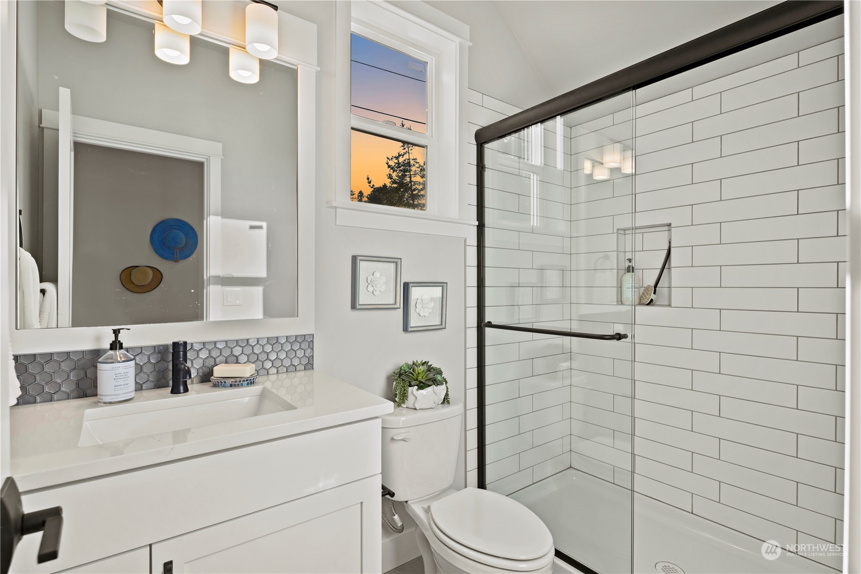 8711 240th Street Southwest Edmonds, WA 98026 - Photo 16 of 37 a bathroom with a sink a toilet and shower