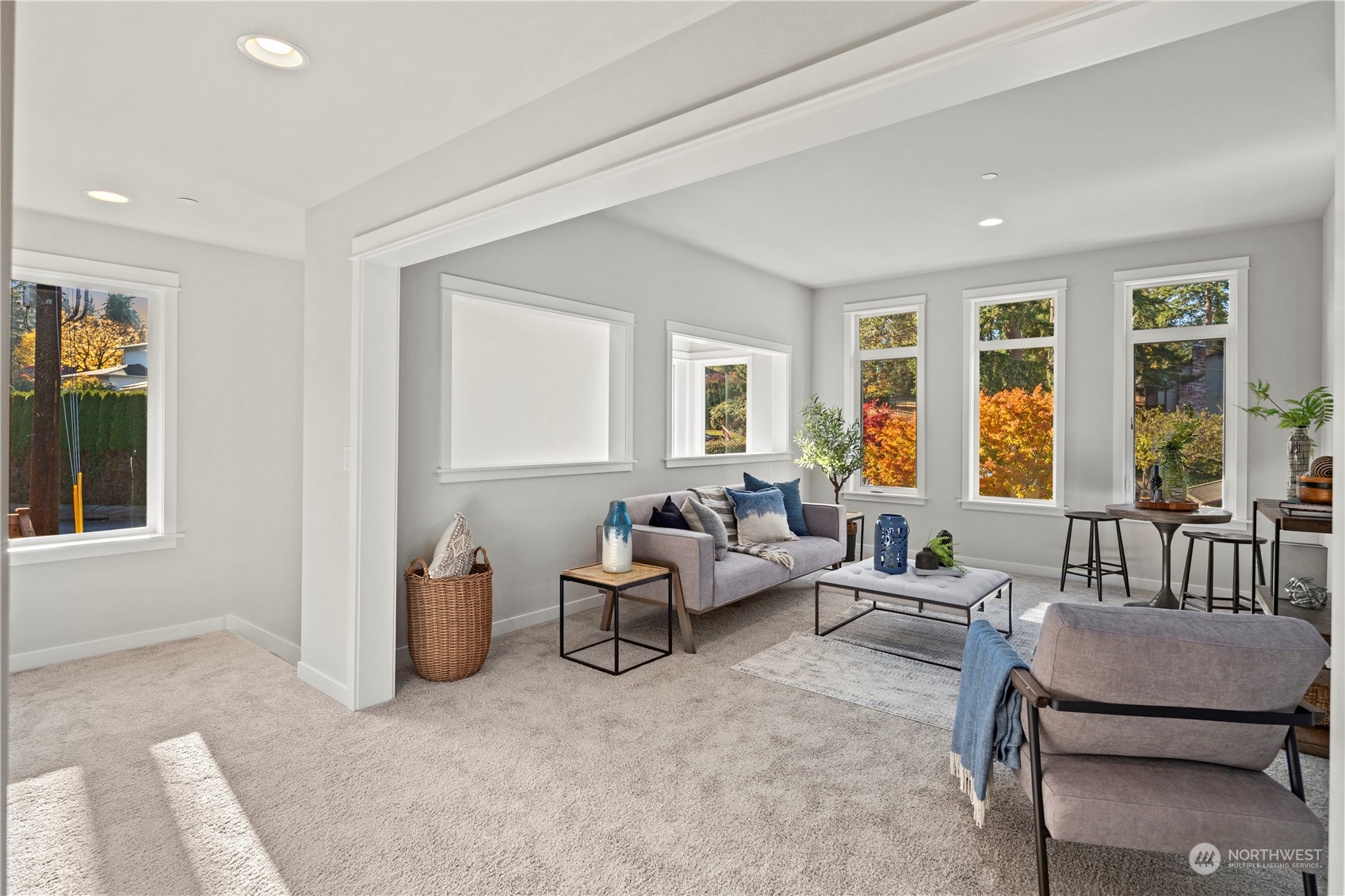 8711 240th Street Southwest Edmonds, WA 98026 - Photo 19 of 37 a living room with furniture and floor to ceiling windows