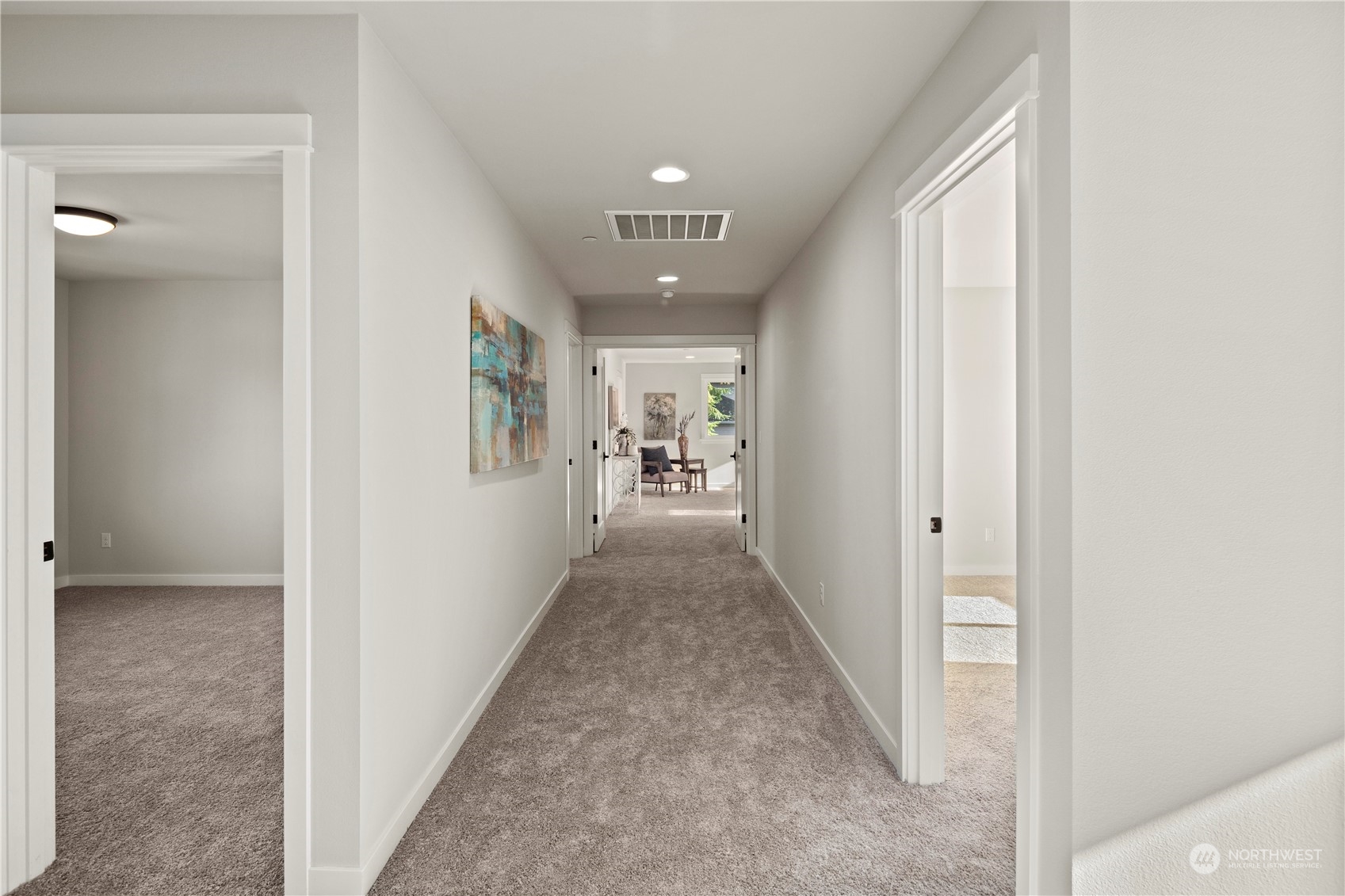8711 240th Street Southwest Edmonds, WA 98026 - Photo 21 of 37 a view of a hallway to a livingroom with wooden floor and a window