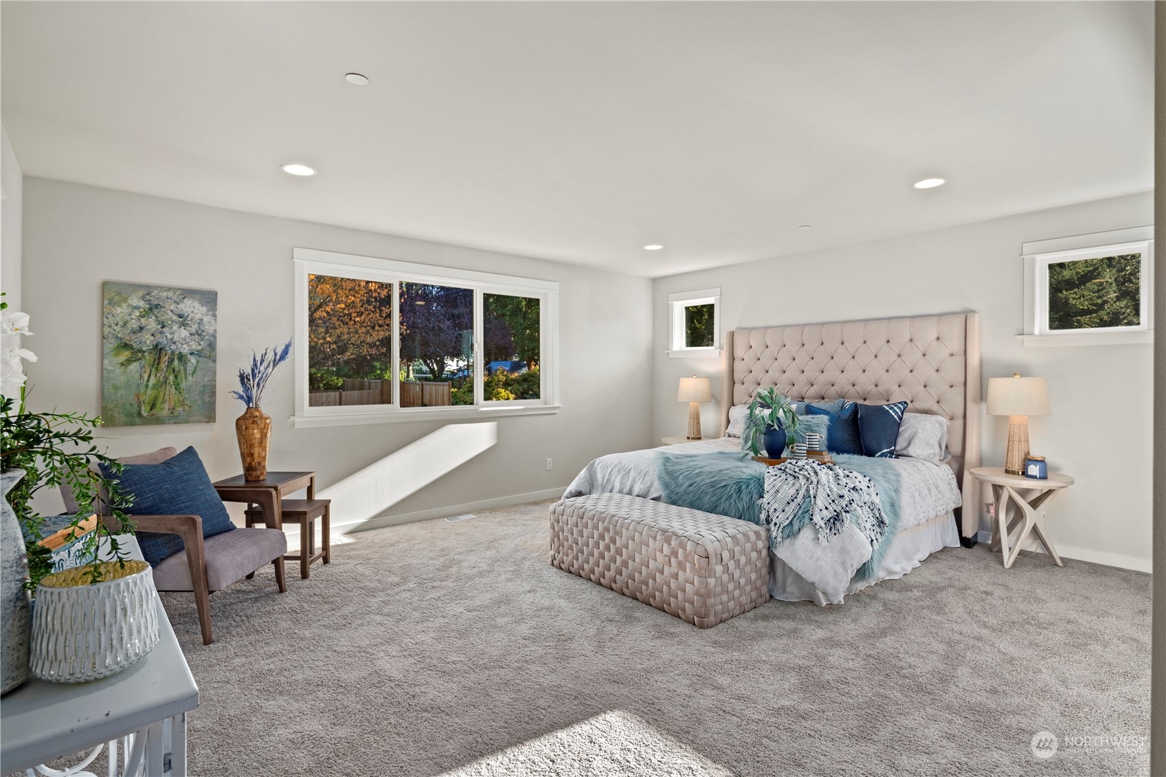 8711 240th Street Southwest Edmonds, WA 98026 - Photo 22 of 37 a spacious bedroom with a bed and a couch