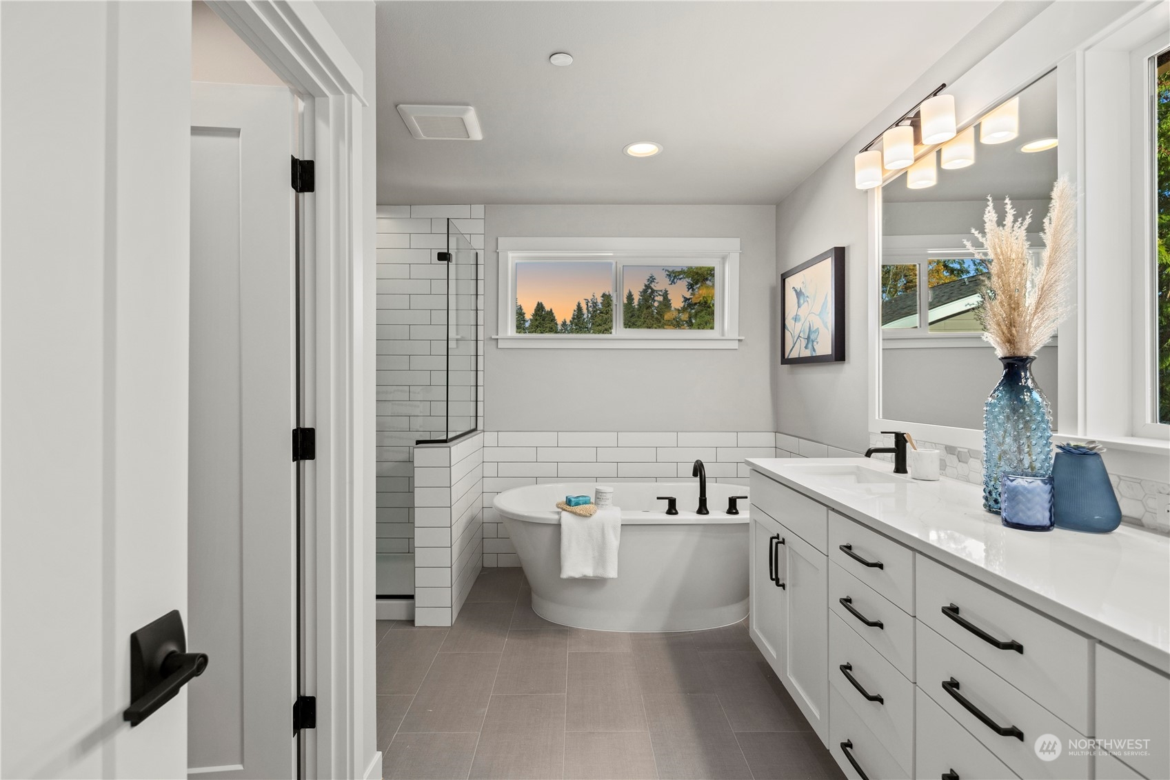 8711 240th Street Southwest Edmonds, WA 98026 - Photo 25 of 37 a bathroom with a double vanity sink mirror and bathtub