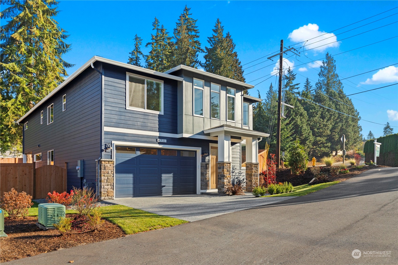 8711 240th Street Southwest Edmonds, WA 98026 - Photo 36 of 37 a front view of a house with a yard and garage