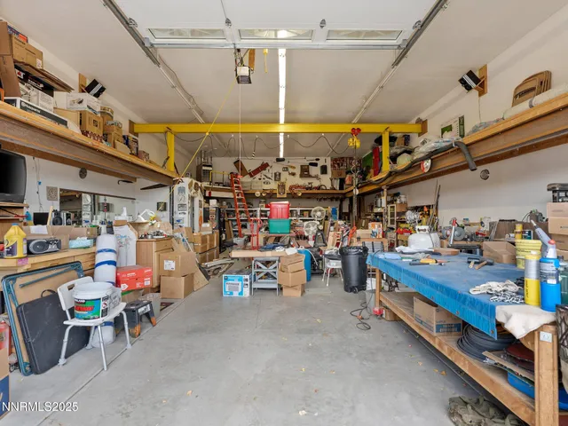 a kitchen with stainless steel appliances a sink cabinets and wooden floor