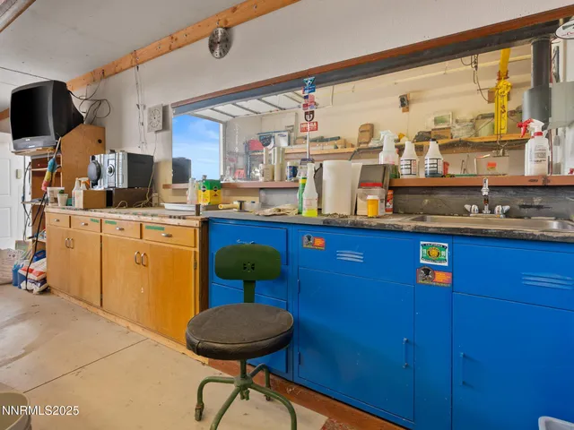 a white toilet sitting next to a bathroom sink