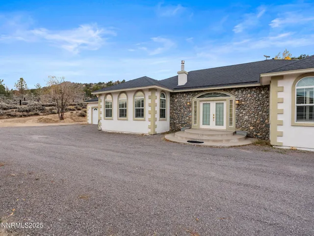 front view of a house with a road