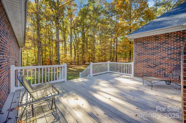 a view of a chair and table on the wooden floor