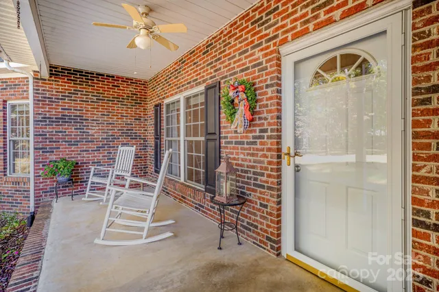 a view of porch with a door and chair