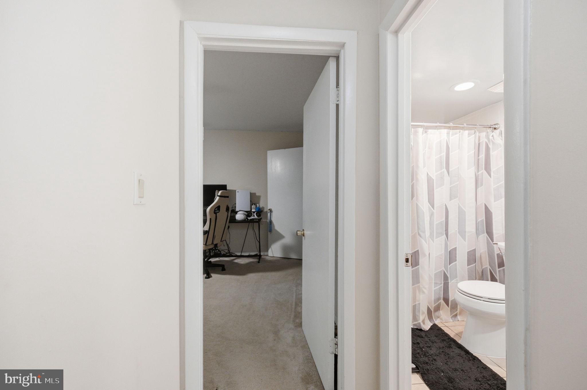 3366 Woodburn Road, Unit 23 Annandale, VA 22003 - Photo 10 of 16 a view of a bathroom from a hallway
