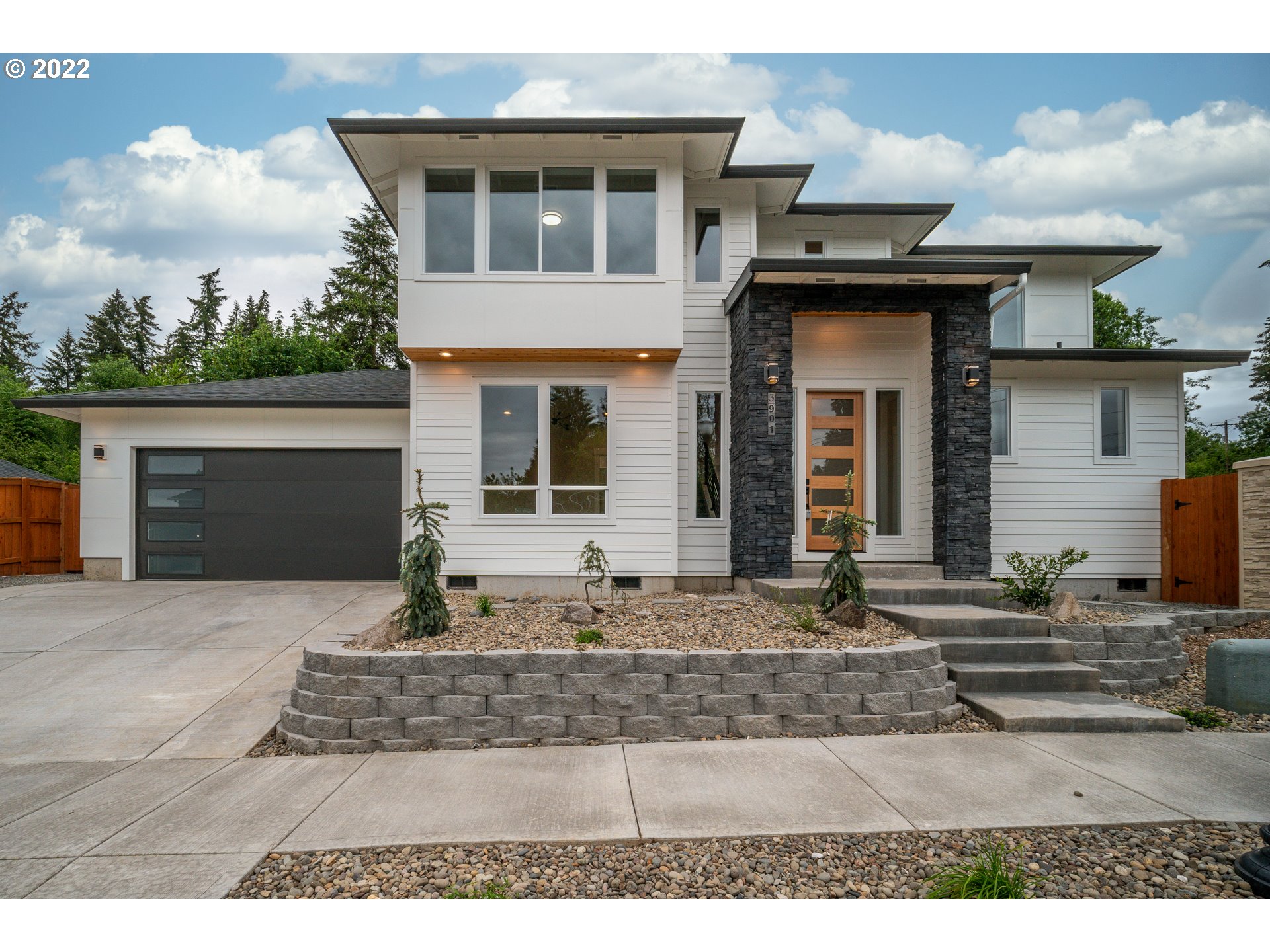 3901 South Hay Field Circle Ridgefield, WA 98642 - Photo 1 of 30 a front view of a house with a yard and garage